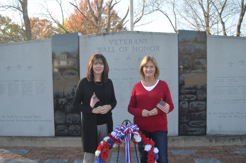 Karen Niemic Buchheit and Kathy Moore stand at the site of the wall of honor.